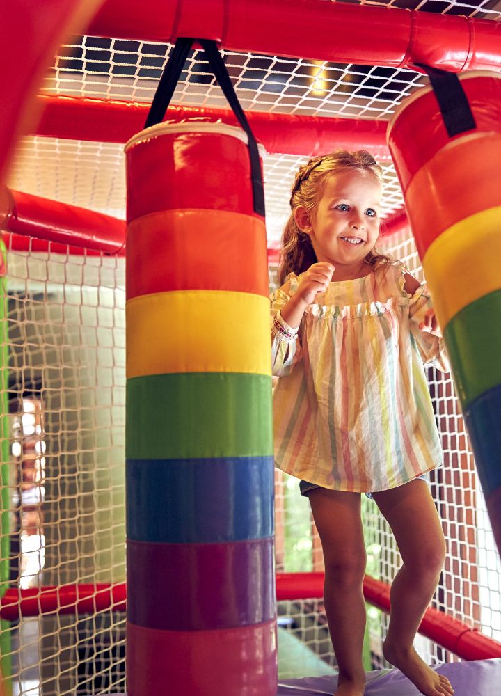 Kids playing in indoor playstructure