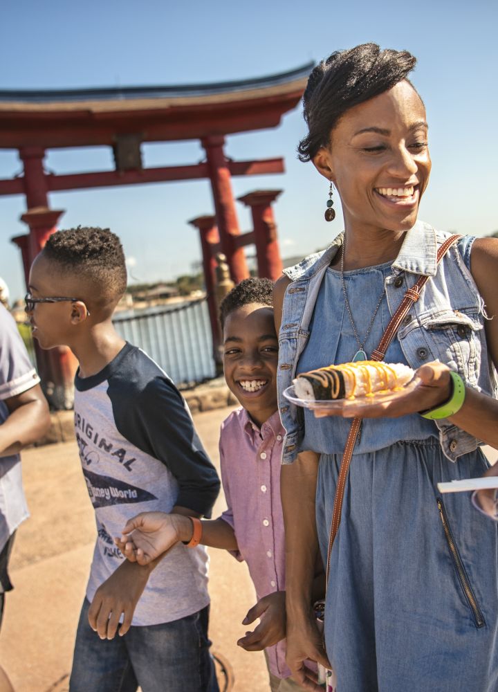 family walking outside with food