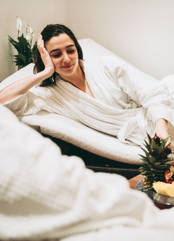 Woman relaxing in spa robes