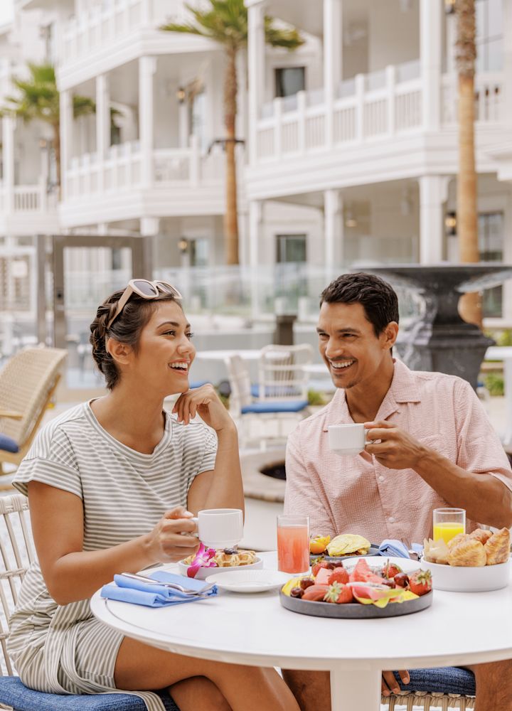 couple having breakfast at outdoor table