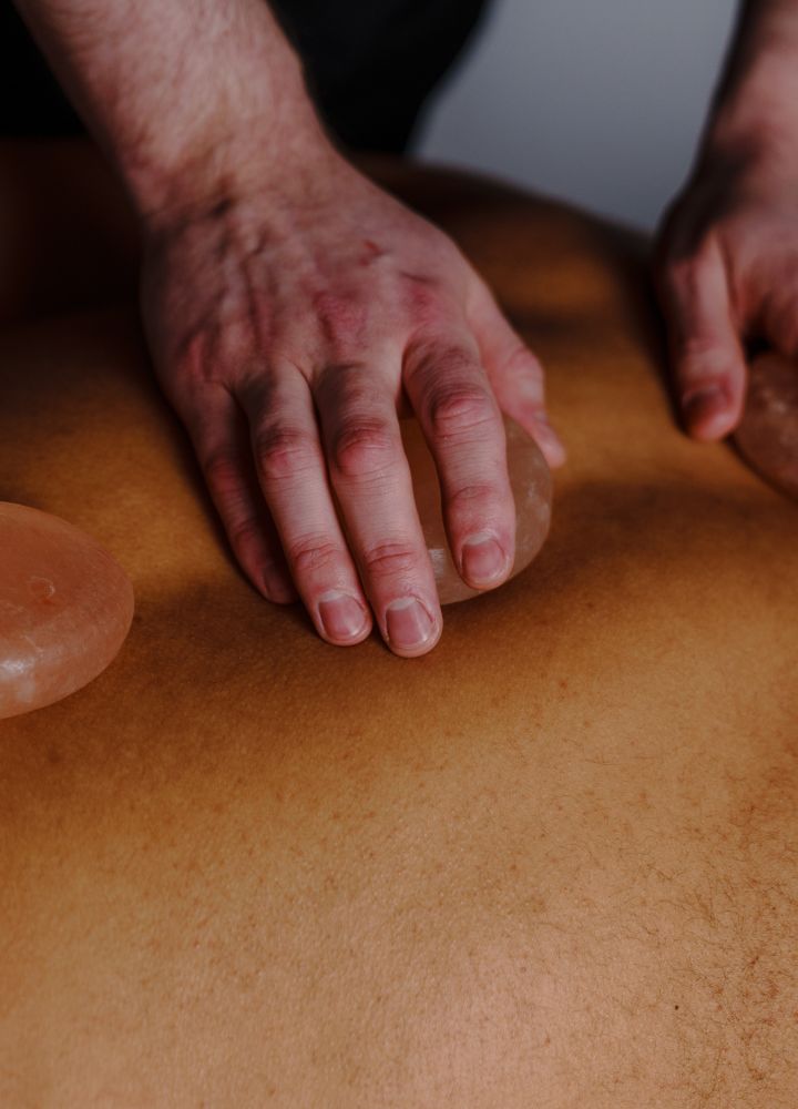 Person Getting a Salt Stone Massage at the Spa