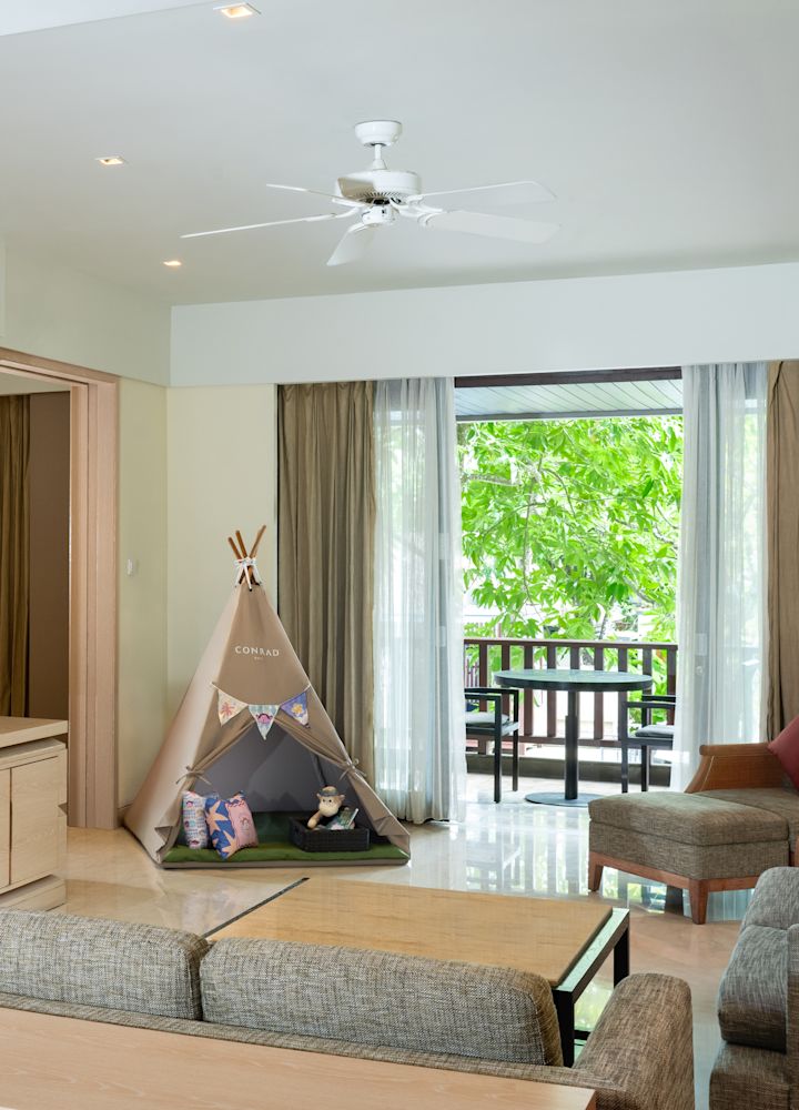 Living Area with a Tepee and Partial View of a Separate Bedroom in a Family Suite with Balcony