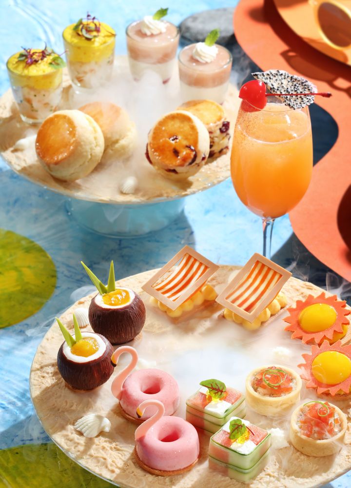 Dessert platters with cocktail in middle