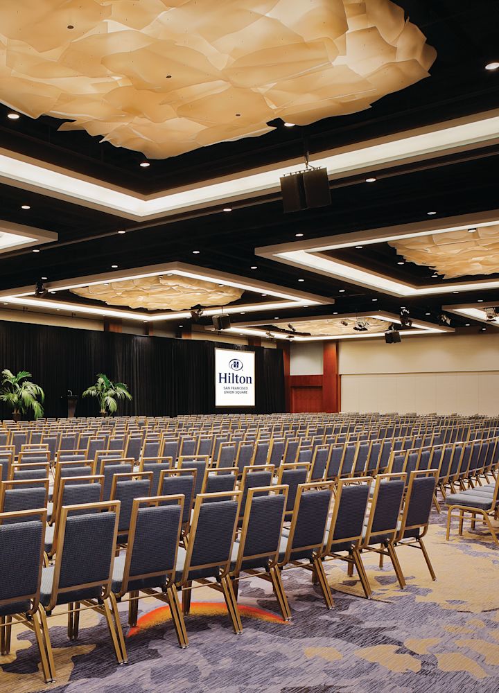 meeting space with rows of chairs for conference