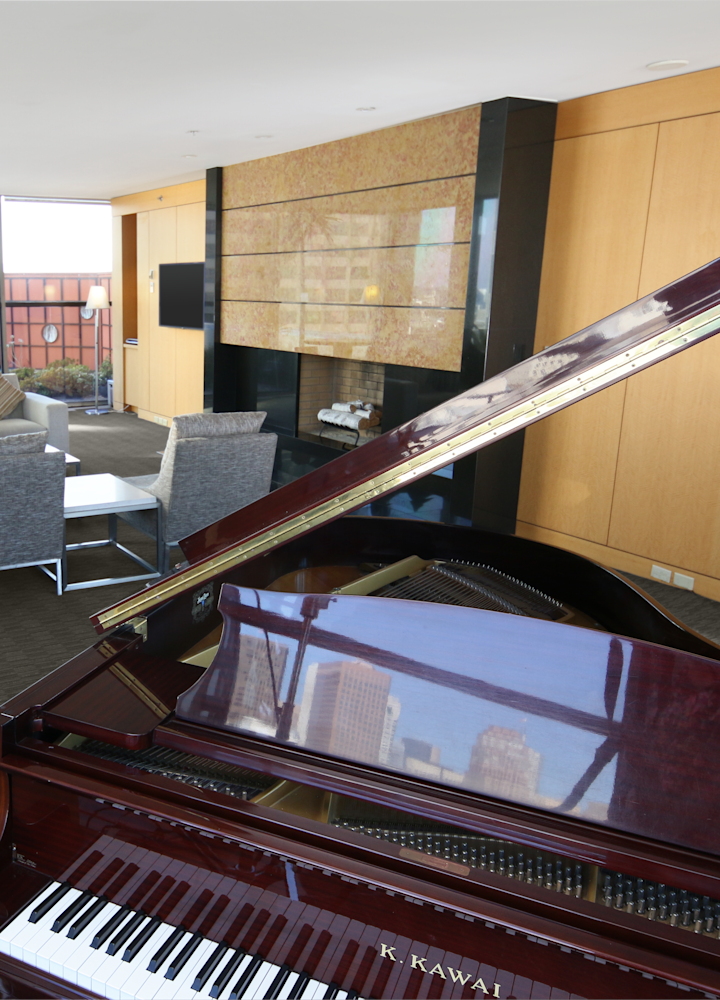 Baby grand piano in the parlor of the two bedroom suite.