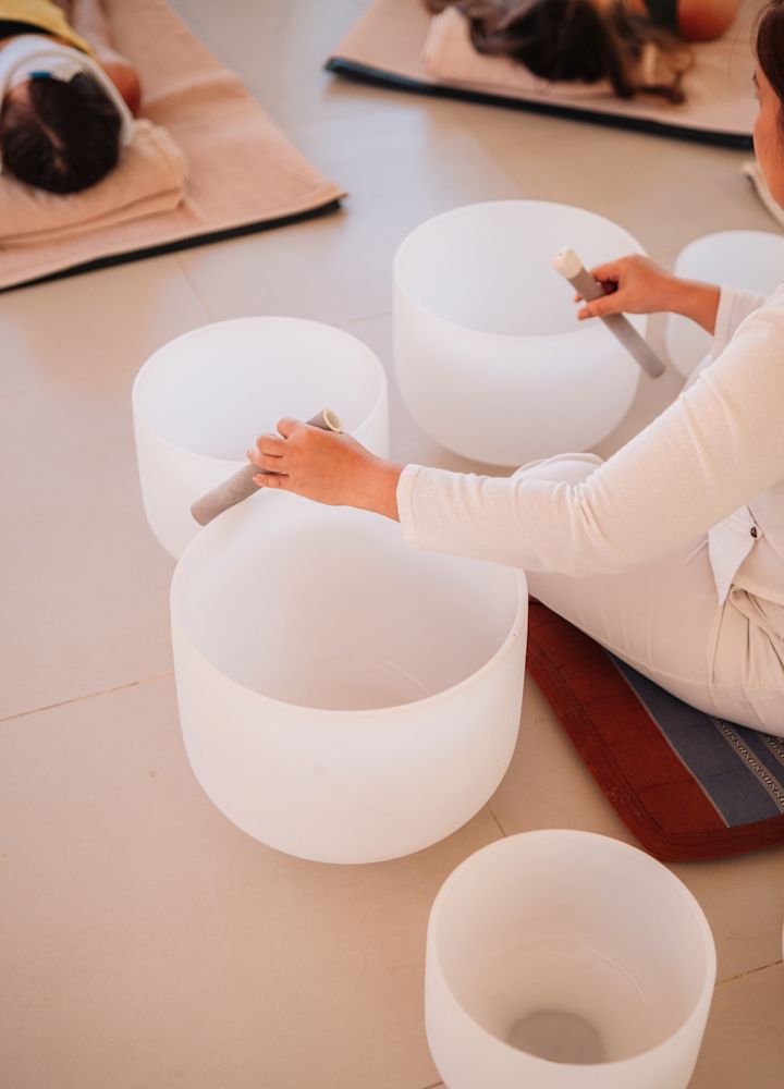 Person playing bowl instruments