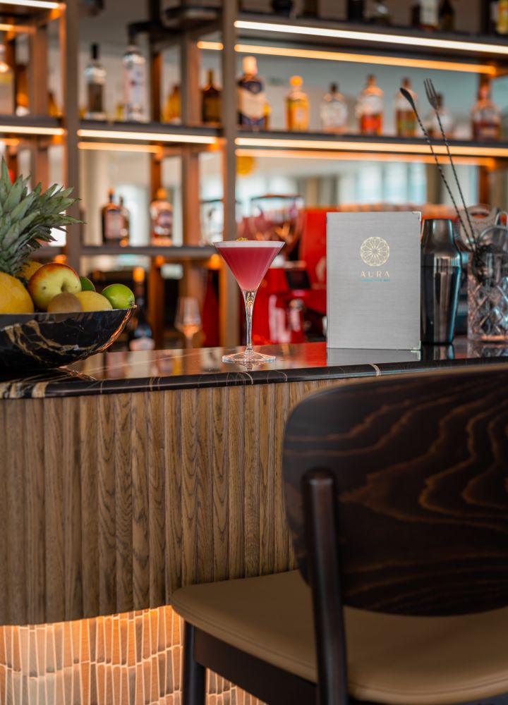 Longe bar image with cocktail and menu at bar