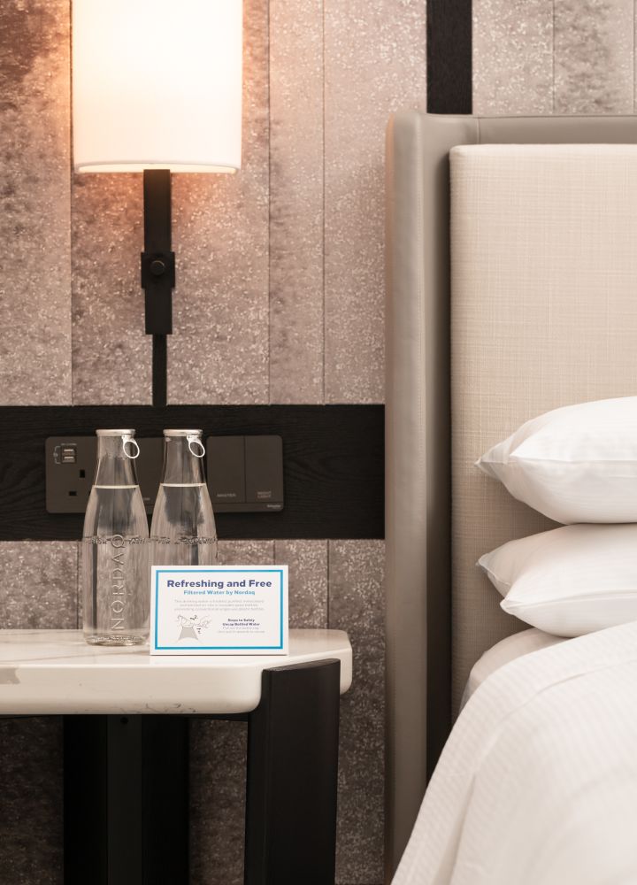 bedside water in guest room