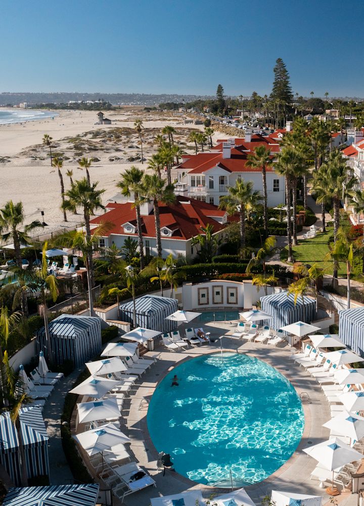 Aerial view of hotel and pool with beach view