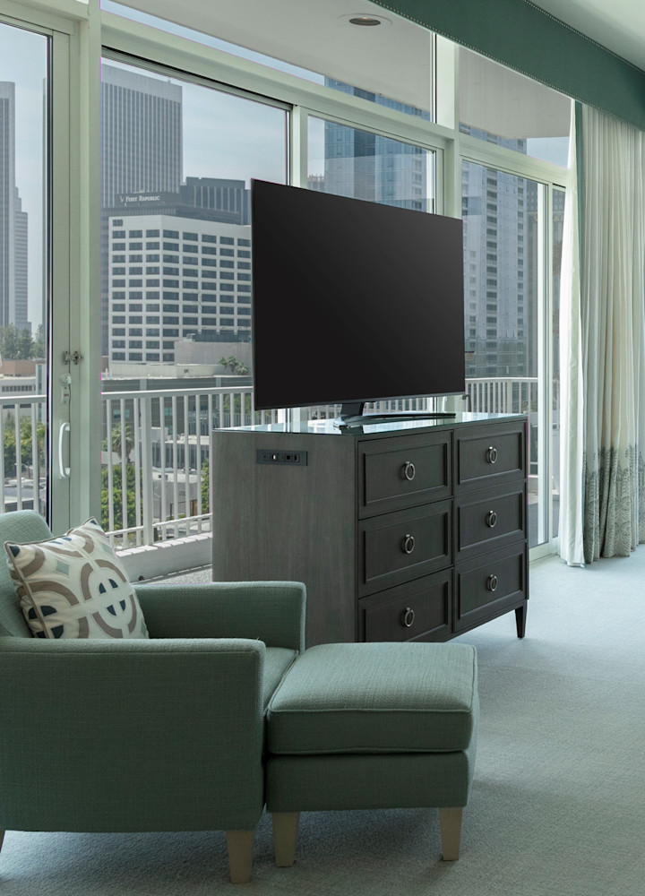Bed in room with TV