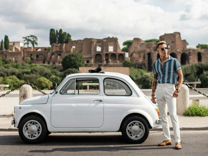 Man standing in front of a Fiat