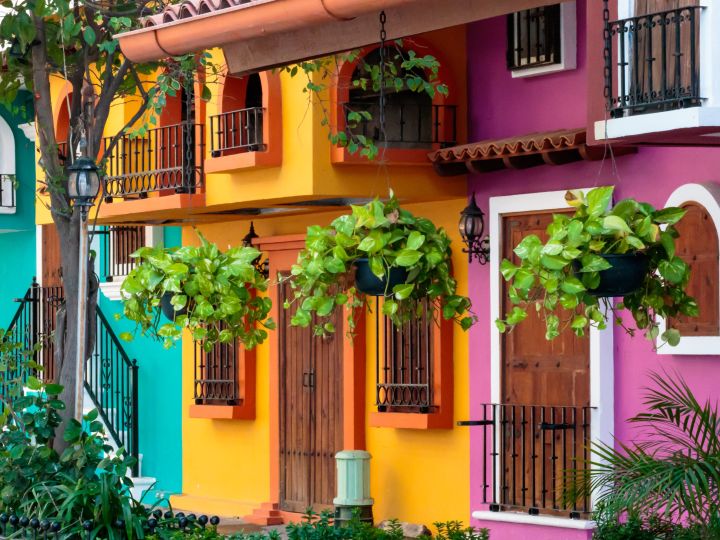 Exteriors of brightly painted houses