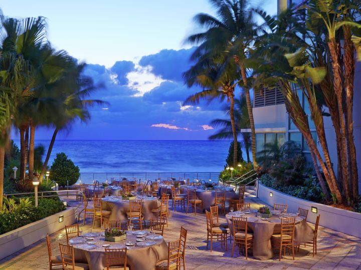 Outdoor event space, banquet tables, ocean view