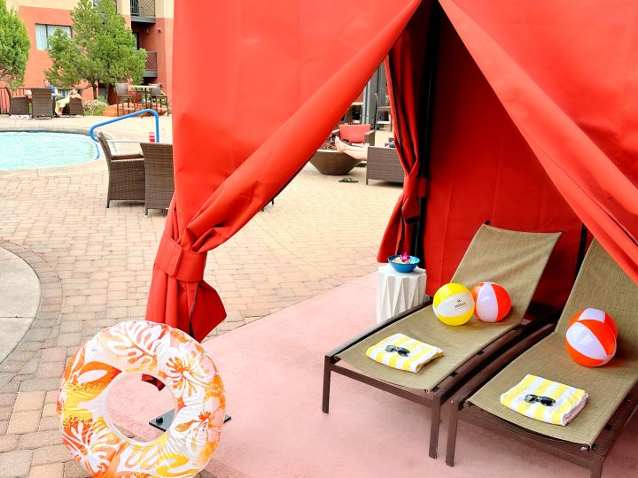 cabana, loung chairs, beach balls and intertube