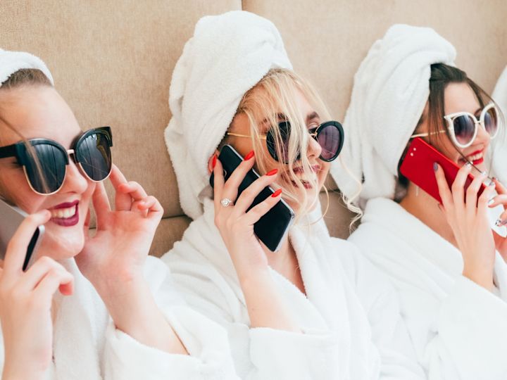 a Group of Women Talking on the Phone and Enjoying a Relaxing Day at Conrad Spa