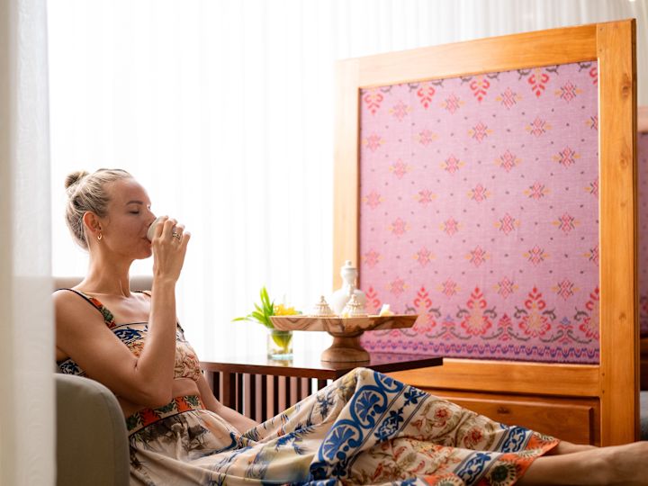 Woman Relaxing and Enjoying a Drink at Conrad Spa