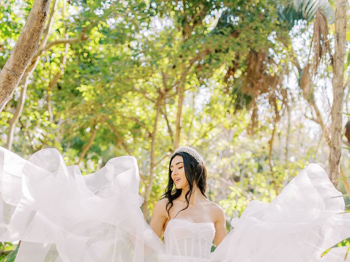 Woman Wearing a Wedding Dress in a Garden