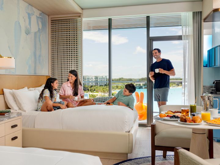 family enjoying room service in a guest suite