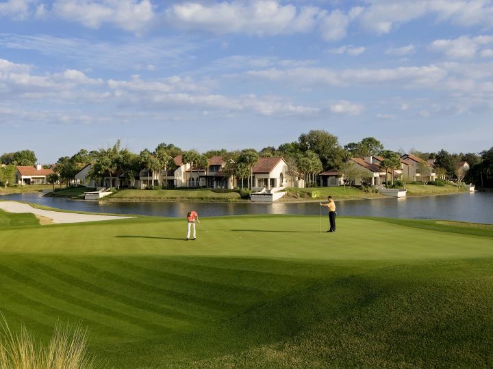 Grand Cypress golf course with two golfers putting