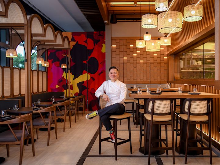 Chef Reif  sitting in The Terrace restaurant dining room
