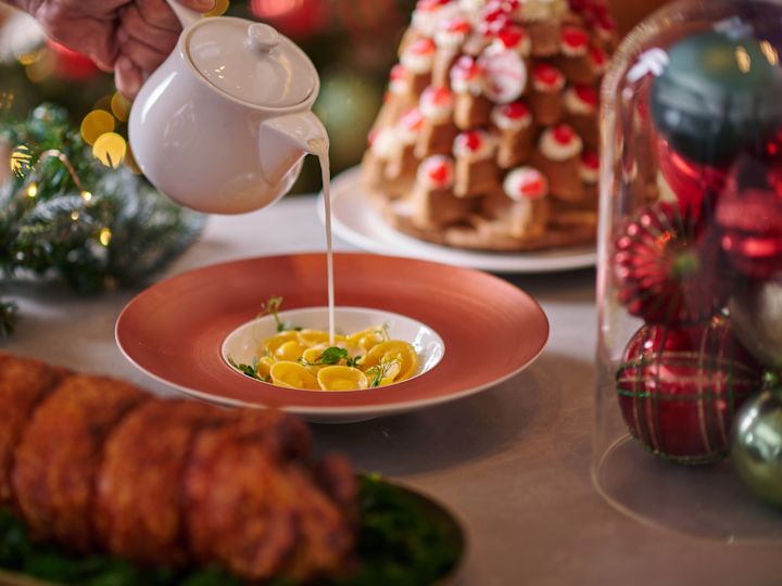 bowl of food with table filled with christmas decorations