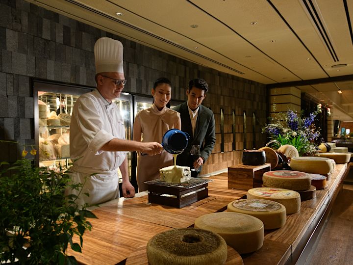 Chef and staff members working in cheese room