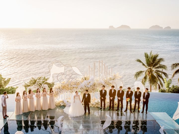 Wedding group with ocean behind
