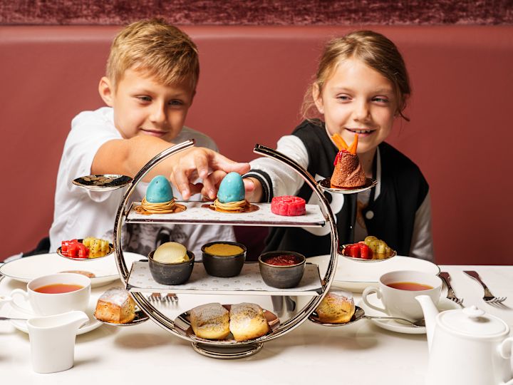 The Court, afternoon tea set up, kids reaching for dessert