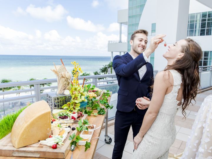 Bride and groom with cheese platter