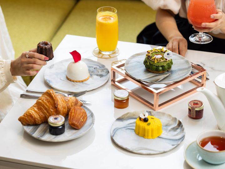 Two Women Having Drinks, and Desserts At Caffe Restaurant
