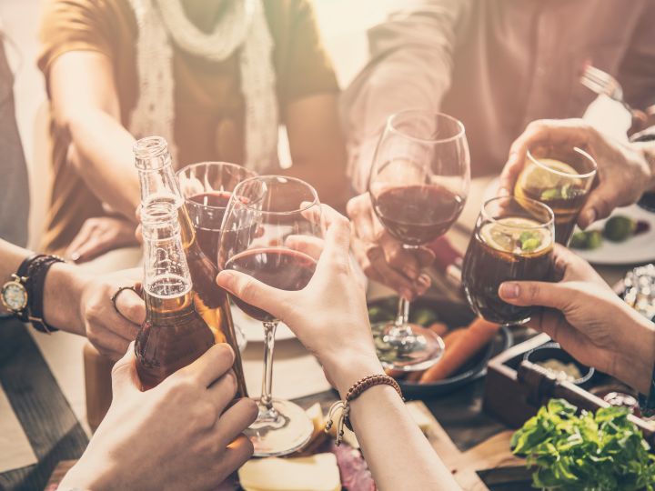 a group of people drinking beer and wine on a tour