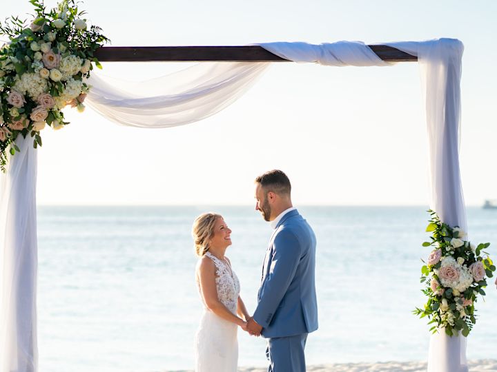 beach wedding, bride and groom holding hands