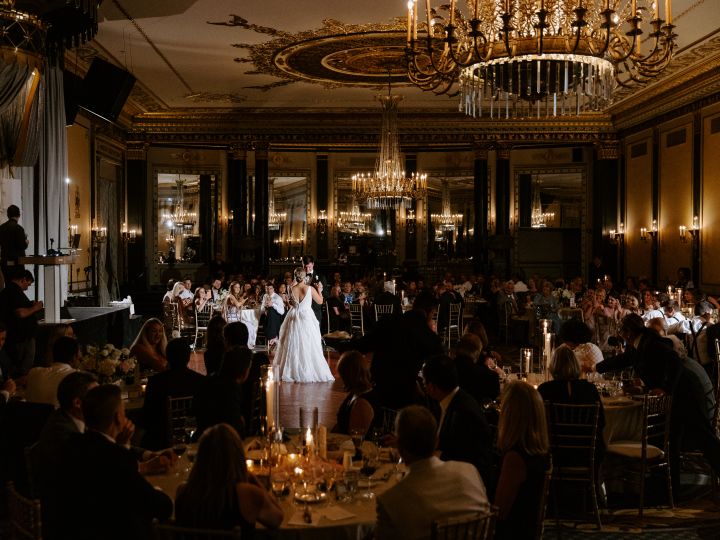a Couple Celebrating Their Wedding in a Ballroom
