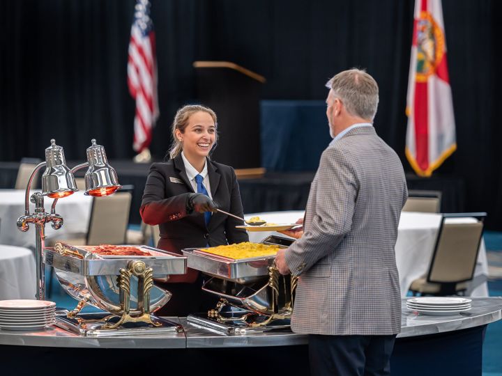 Waiting staff serving customers