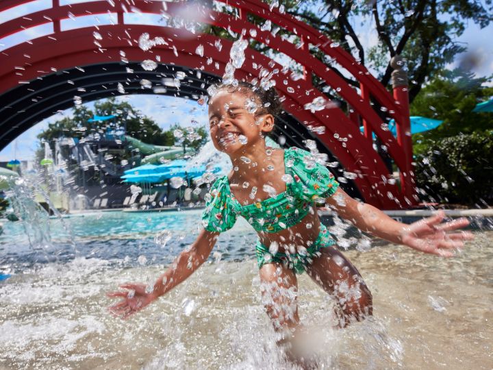 little girl splashing in the pool at Jade Waters
