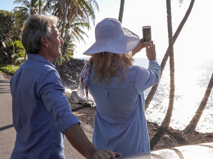 guests taking pictures of the beach