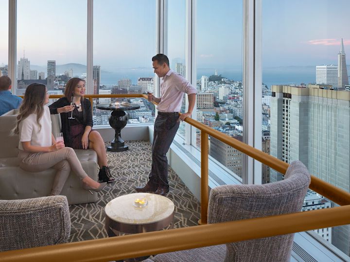 People Having Drinks at Cityscape Sky Bar with Views of the City