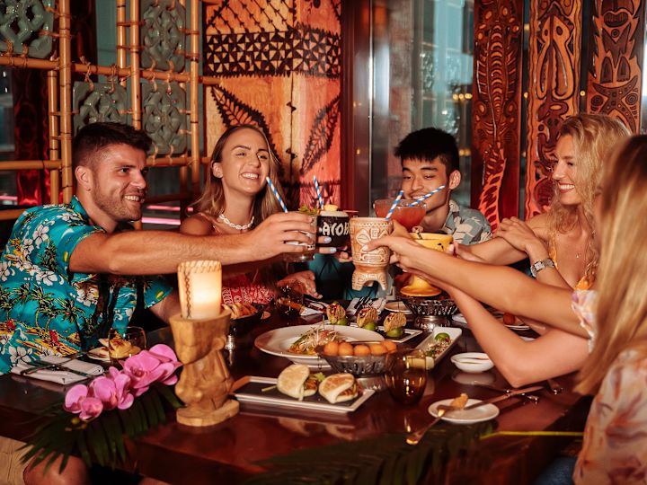 Friends Drinking and Eating at Trader Vics Atlanta