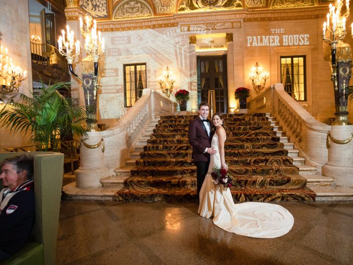 Bridge and groom at foot of stairs