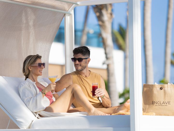 models eating and drinking by the pool