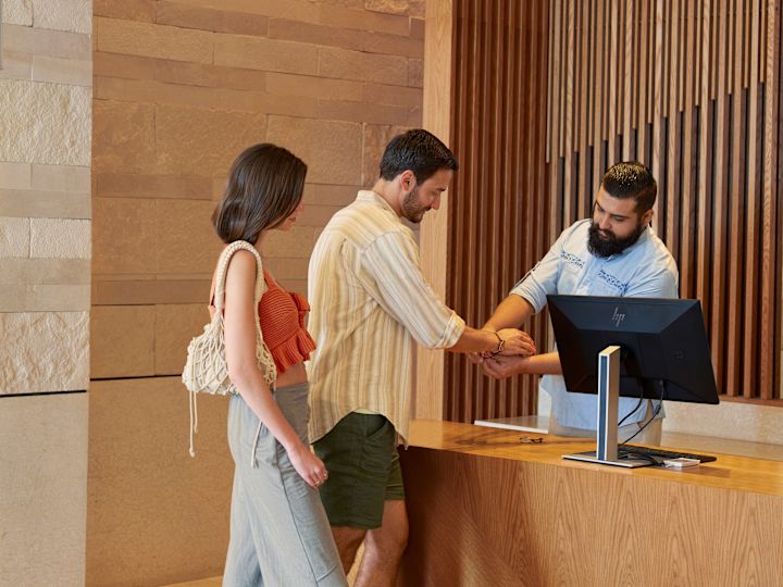 Couple at lobby getting wristband setup