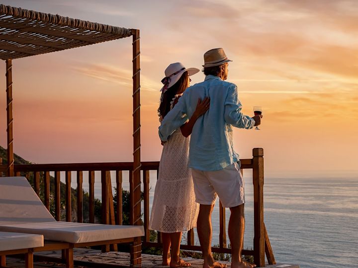 couple looking at the sunset on a beach