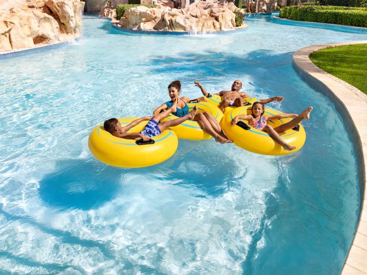Guests drifting on the lazy river in tubes