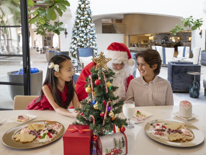family eating at table with Santa