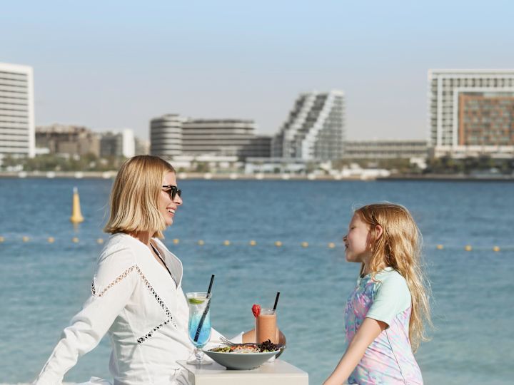 Mother and Daughter Dining at the Beach