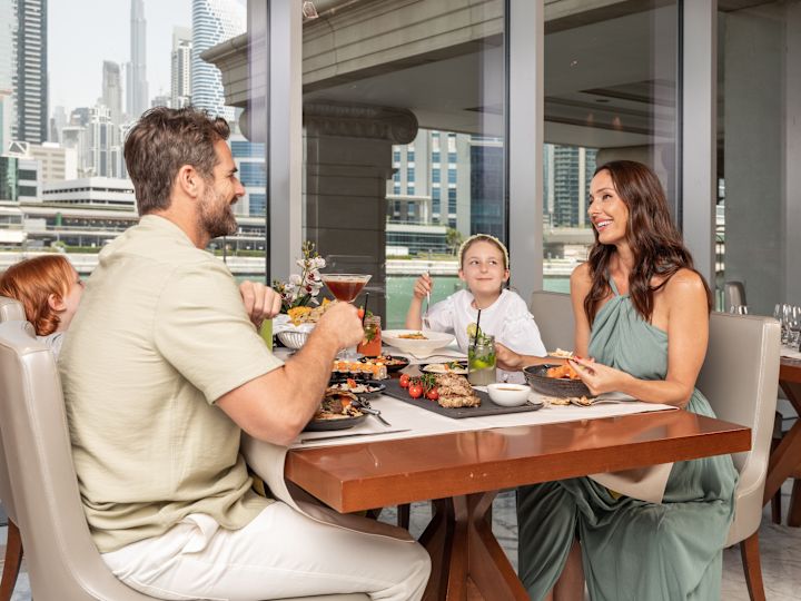 Family having dinner in restaurant