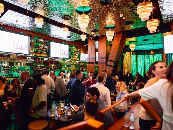 Interior of McGettigans bar with groups of people enjoying themselves