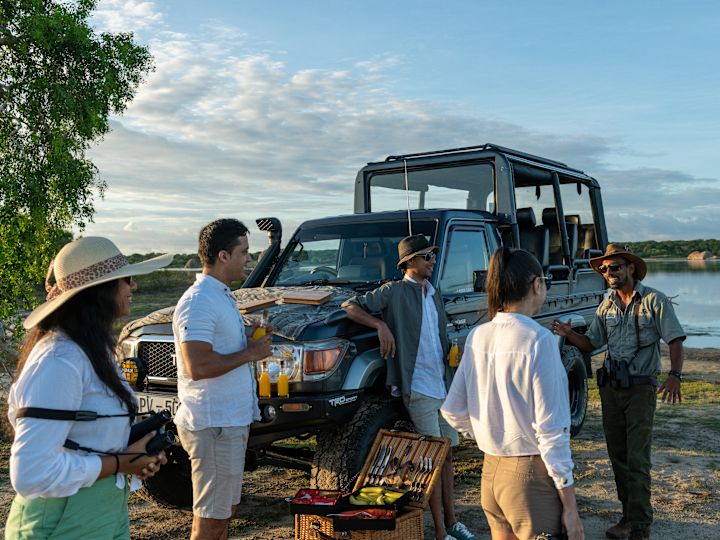 a Group of People Enjoying a Safari Program at a National Park