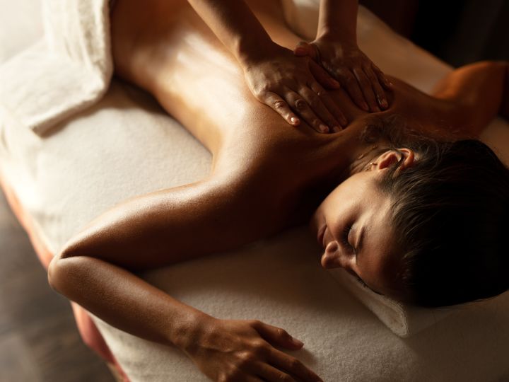 Woman on spa treatment table having a back massage