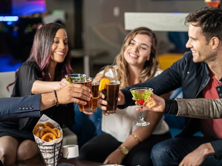 Group of friends raising their glasses